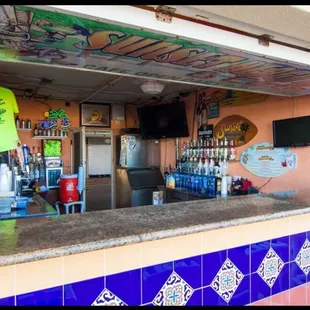 The beach bar is steps from the sand and ocean! Great for sunsets!