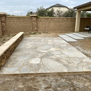 Flagstone patio and masonry seat wall.