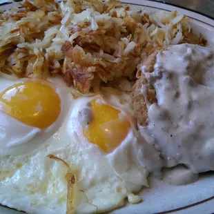 I like how they over cooked my sunny side up eggs and cut around the white cap to pull it off the yoke, nice.