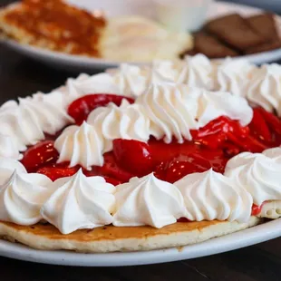 Pancakes with Strawberry glaze and whipped cream - perfect for an Easter Sunday brunch