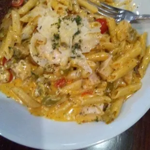 Pasta Diablo with chicken at the Sunset Grill. Penne pasta in a cheesy chipotle sauce with garlic toast