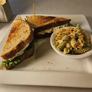 Chicken salad sandwich with pasta salad.