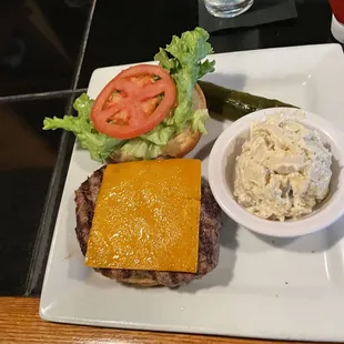 Cheddar Cheeseburger with a side of potato salad. The BEST tasting Burger ever! Potato salad delish too.
