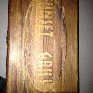 They bring the bill in these cigar boxes.