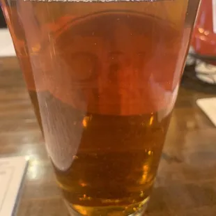 a glass of beer on a table