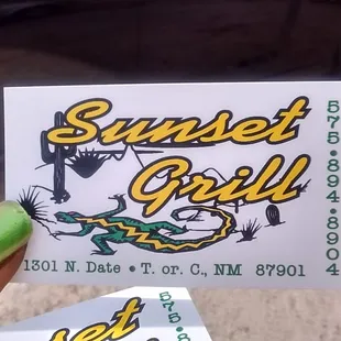 a person holding a sticker