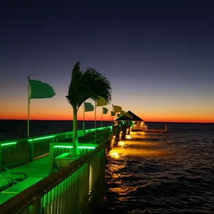 a view of a dock at sunset