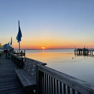 a view of the sunset from a dock