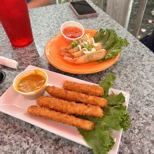Calamari Fries with a curry sauce and Shrimp Rolls with chili sauce
