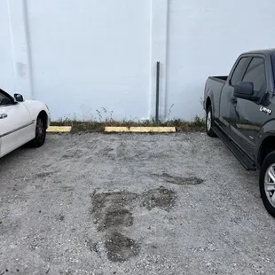 two cars parked in a parking lot