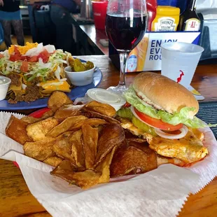 Grilled Buffalo chicken sandwich, house made chips, nachos supreme