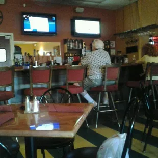 a woman sitting at a bar