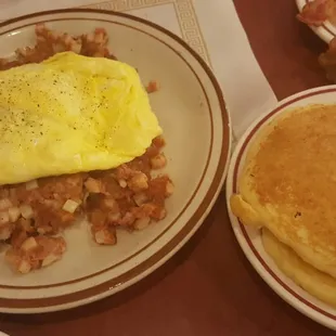 Corned beef hash, eggs, and pancakes