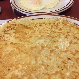 Swedish pancakes with over easy eggs and bacon