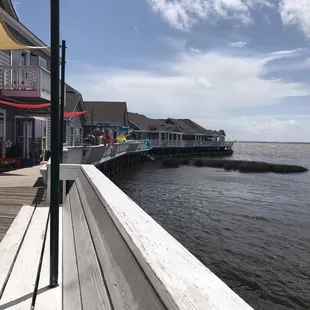 a pier with a boat dock in the background