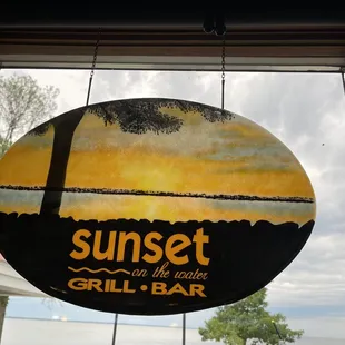 a sign hanging from a window