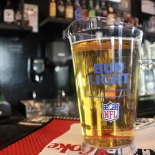 a glass of beer on the bar