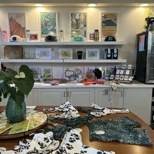 a table with a bunch of cloths on it