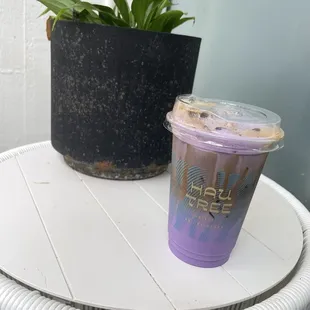 a purple drink and a potted plant