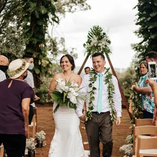 Bride and groom exit walk at Sunset Ranch Hawaii | Wedding Photography by HNL Studios www.hnlstudios.com