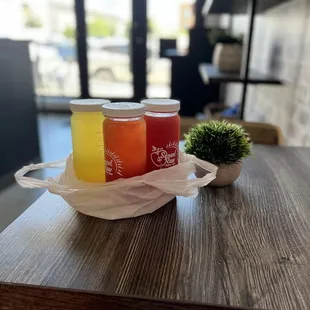 two jars of juice on a table