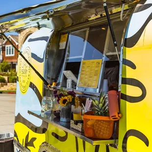 the food truck parked on the side of the road