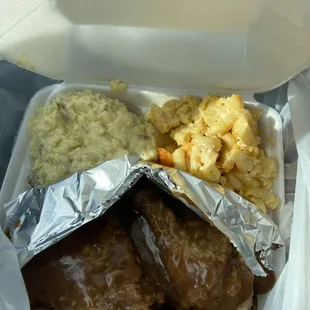 Smothered chicken, Mac and cheese and potato salad