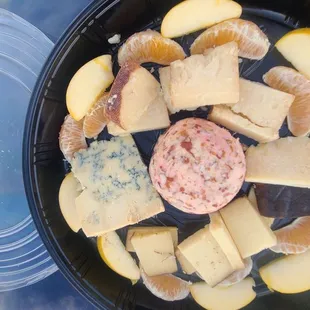 D'Cheese plate I made for bowling w Stilton, cipolini, barely buzzed ut cheddar, rose almond cheese ball, opal apples, sumo oranges