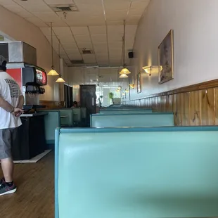 a man standing in a diner