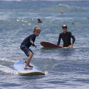 My son got up on his first wave! It was small, but it was perfect for him :)