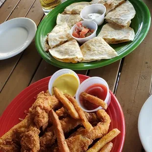 a plate of fried chicken and fries