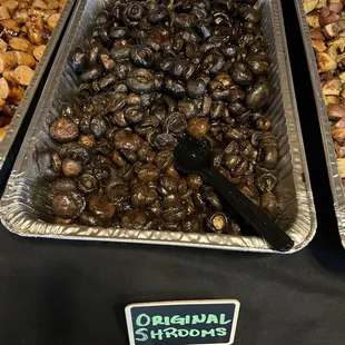 three trays of roasted mushrooms