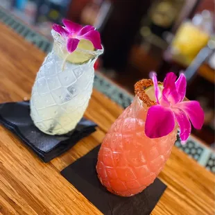 two cocktails on a bar top