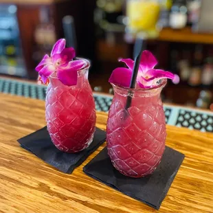 two cocktails on a bar top