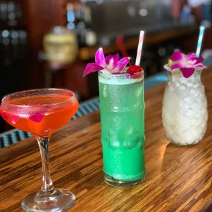 two cocktails on a bar