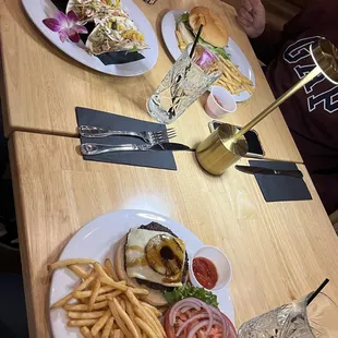 Pipeline shrimp tacos (top left), beach fire burger (top right), island burger (bottom left)