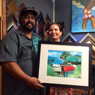 Kawika Kahiapo and his art with gallery manager, Laetitia.
