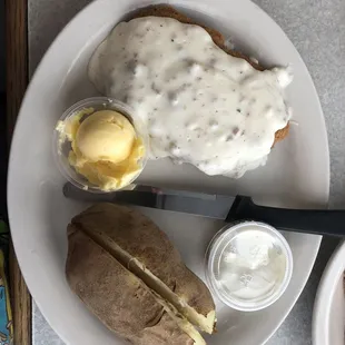 Country Fried Steak and Baked Potato with Butter and Sour Cream
