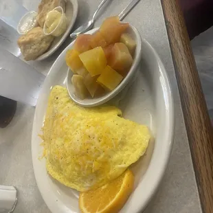 Fresh fruit and omelette