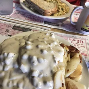 country eggs in the background, sausage gravy and biscuits in the foreground