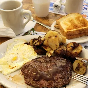 Ribeye &amp; eggs both done medium home fries nice Brown toast cawfee little splash of A1 for the steak. 06/29/22