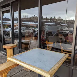 the reflection of a woman in the window