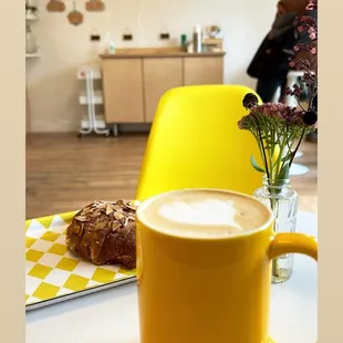 a cup of coffee and a plate of pastries