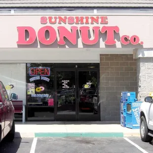 the entrance to a donut shop