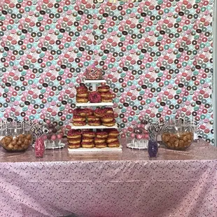 a dessert table with donuts on it