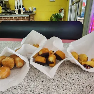 Enjoying different donut holes at one of the 2 booths