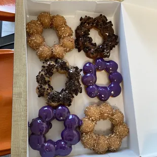 a variety of doughnuts in a box