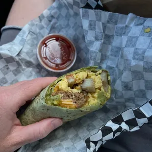 Vegan breakfast burrito cut in half