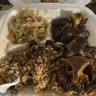 Small oxtail meal. At the top of the tray is rotten mushed plantain.