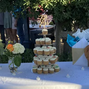 a table with cupcakes on it